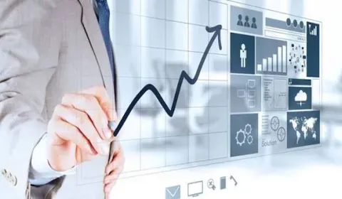An advisor drawing a rising growth chart, representing strategy and regulation