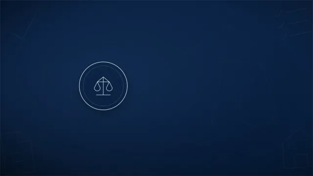 Business partners shaking hands over a laptop while agreeing on a company structure